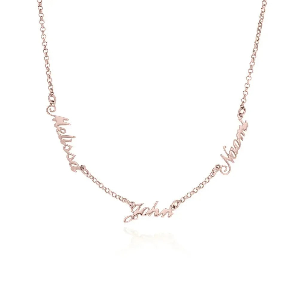 Close-up of Signature Chain Necklace showing engraved text detail in rose gold